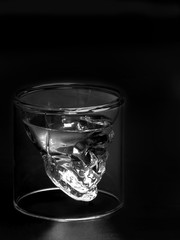 Glass shape like skull  in dark light
