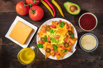 Nachos with cheese, traditional Mexican snack, with ingredients