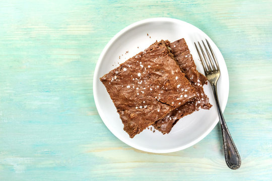 Overhead Photo Of Chocolate Brownies On Teal Texture