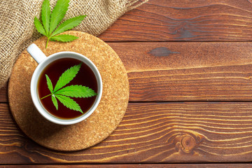 Cannabis herbal tea and marijuana leaves