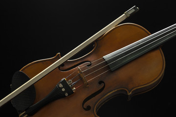 Fototapeta premium Old violin on a black background