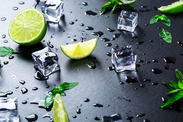 Lime, mint and ice cube on a white background.