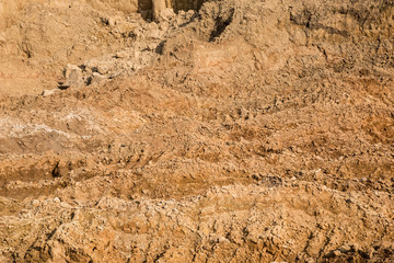 Clay and sand in the quarry. Beautiful unusual background similar to the surface of the planet Mars or the moon