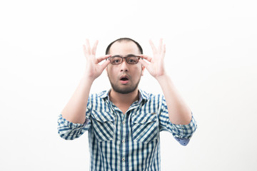 Naklejka premium Portrait of young handsome man isolated on white background touching his glasses.
