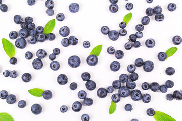 Fresh blueberry with leaf on white background