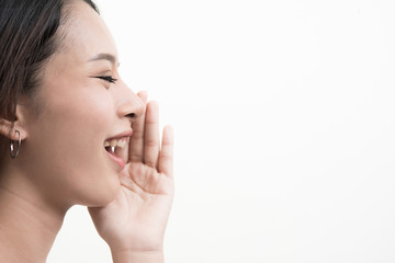 Portrait of a beautiful young woman shouting isolated on white background.