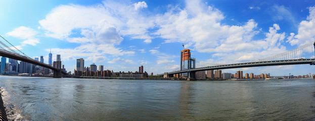 Panoramic view of manhattan bridge and Brooklyn bridge with Manhattan skyline from DUMBO District