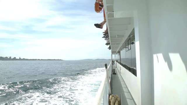 View from boat. Foot of passengers