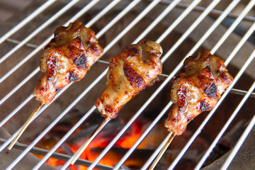 Chicken grilled on charcoal grills