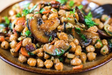 Boiled chickpea with roasted chapignon, carrot, onion, zucchini and parsley leaf.