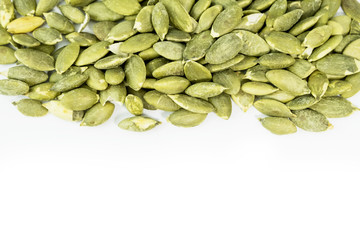 Pumpkin seeds on a white background