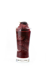 Mulberry juice in clear glass isolated on white background