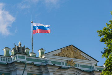 the Russian Federation flag flies over the building.