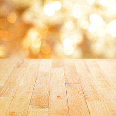 Naklejka na ściany i meble Wood table top on shiny bokeh gold background