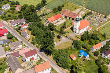 Fototapeta premium aerial view of the Ligota Wielka village and harvest fields