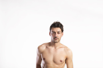 Fototapeta premium Shirtless fitness man. Studio shot. White background.