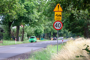 Dangerous road and warning sign with caution accidents description