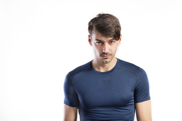 Obraz premium Handsome fitness man in blue t-shirt, studio shot.
