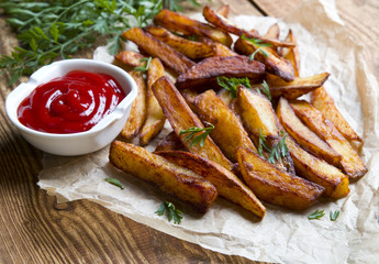Home fries on wooden background