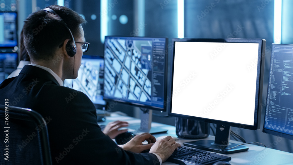 Aufkleber Professional IT Engineers Working in System Control Center Full of Monitors and Servers. Possibly Government Agency Conducts Investigation. He Works With White Screen Isolated. Good for Template.