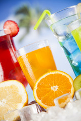 Summer drink, palm branch and Fresh tropical fruits