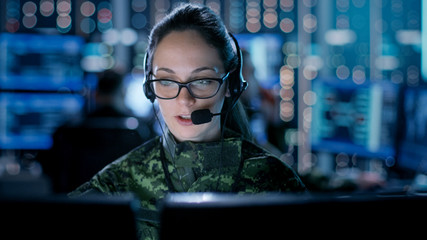 Female IT Engineer Works on Her Desktop Computer in Government Surveillance Agency. In the...