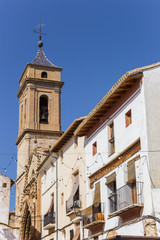 Fototapeta na wymiar Church tower and white houses at the central square of Requena