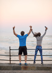 backview of couple celebrating the end of their workout