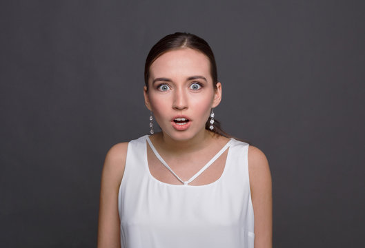 Portrait of young shocked woman
