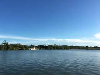 Nature Seascape with Trees And Ferry As Background
