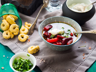 Beetroot soup served in bowls on napkin. Lunch with light vegetarian dish
