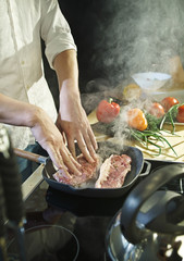 Cooking meat in a flying pan