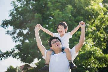 Father and son playing in the park
