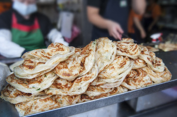 Lane in the traditional Chinese cuisine-scallion pie.