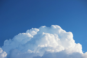 Naklejka na ściany i meble white clouds against the blue sky on a sunny summer day.