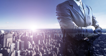 Businessman in front of a big city