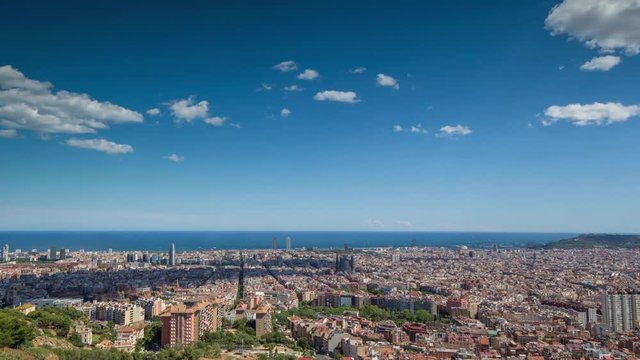 wide angle timelapse of barcelona shot from the bunkers de carmel offering amazing panoramic views over the city skyline