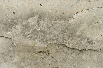 Wall fragment with scratches and cracks