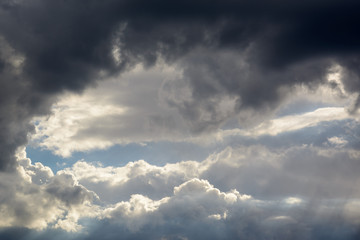a big and fluffy cumulonimbus cloud in the blue sky