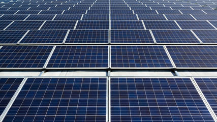 field of solar panels on a rooftop