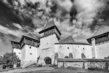 Black and white view of the famous and beautiful Fortified church, Viscri, Brasov, Transylvania, Romania