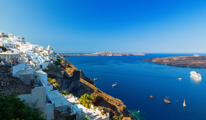 Greece. Cyclades Islands - Santorini Thira town with typical Cycladic architecture and view on the Caldera, Bay and ships docked