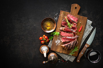 Sliced medium rare grilled beef ribeye steak
