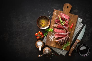 Zelfklevend Fotobehang Sliced medium rare grilled beef ribeye steak © Alexander Raths