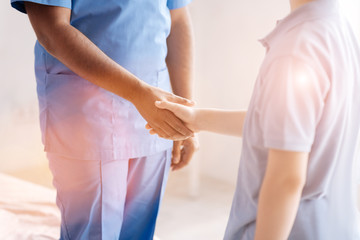 Fototapeta premium Close up of male hands while welcoming each other