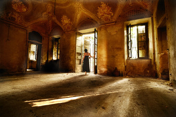 woman in the light in an ancient room,  ancient castle in shine