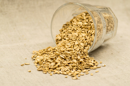 oatmeat porridge flakes in a crystal glass onlinen tablecloth