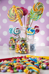 Candies including lollipops, gum balls