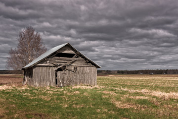 Rain Clouds Over The Old Barn House