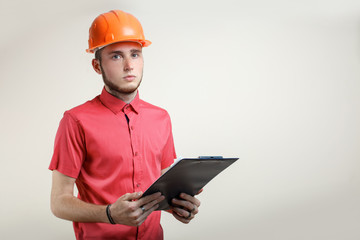 Guy in an orange protective helmet